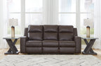Reclining sofa with cushioned back and arms, dark brown upholstery, three seats