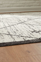 Cream and black distressed rug texture with diagonal grid lines