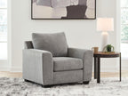 Gray upholstered lounge chair with tall back and thick seat cushion