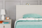 Twin white bookcase headboard with flat panel and top edge beside bed pillows