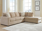 Light brown corner chaise sleeper sectional with neutral cushions and patterned pillows