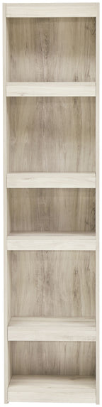 Whitewash wood bookcase with four open shelves and clear cubby compartments