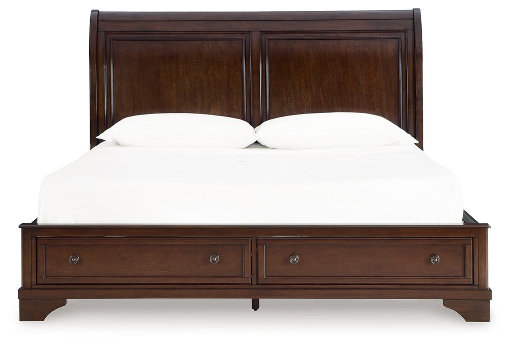Brown king storage bed with paneled headboard, two drawers, and central support rail