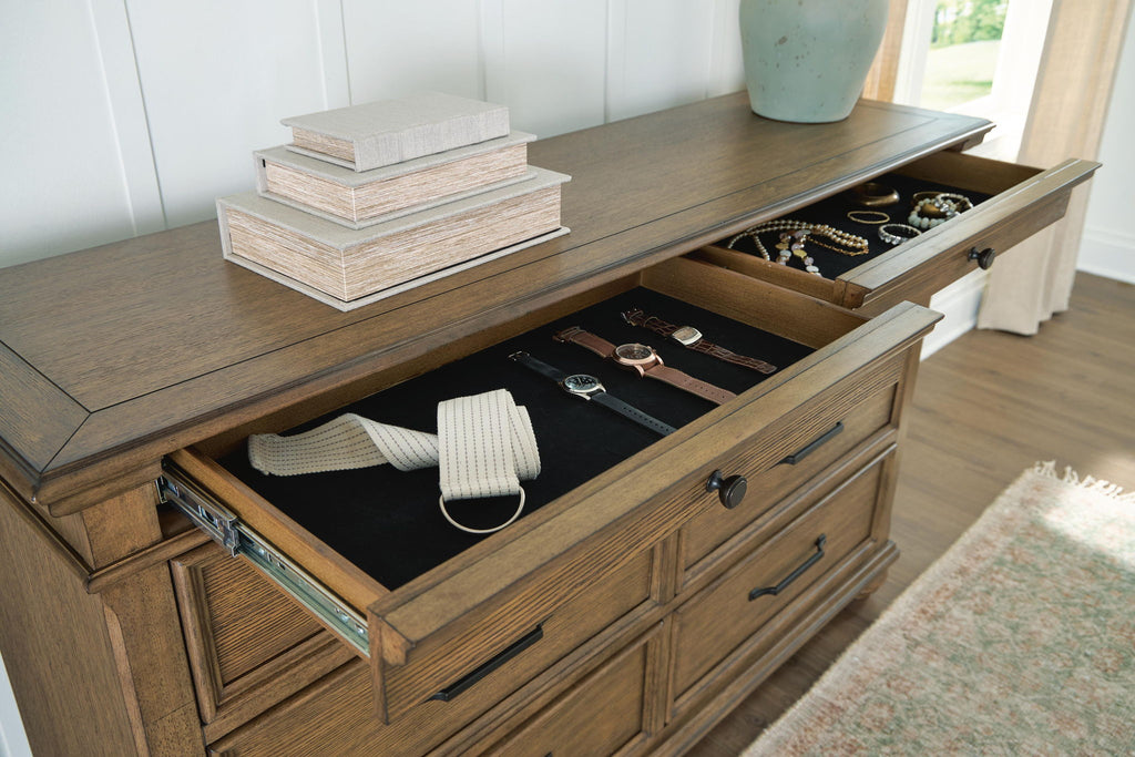 Dark brown dresser with open drawers and metal slides showing items inside; bar pulls.