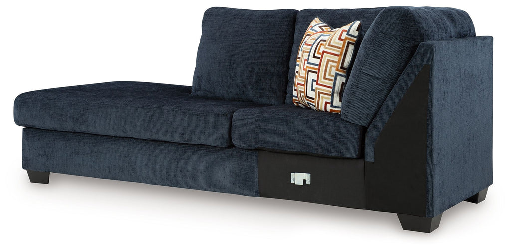 Aviemore dark ink corner chaise with deep seat, back cushions, and geometric throw pillow