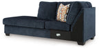 Aviemore dark ink corner chaise with deep seat, back cushions, and geometric throw pillow