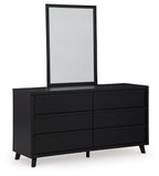 Black dresser with six drawer fronts and upright mirror, clean rectangular frame