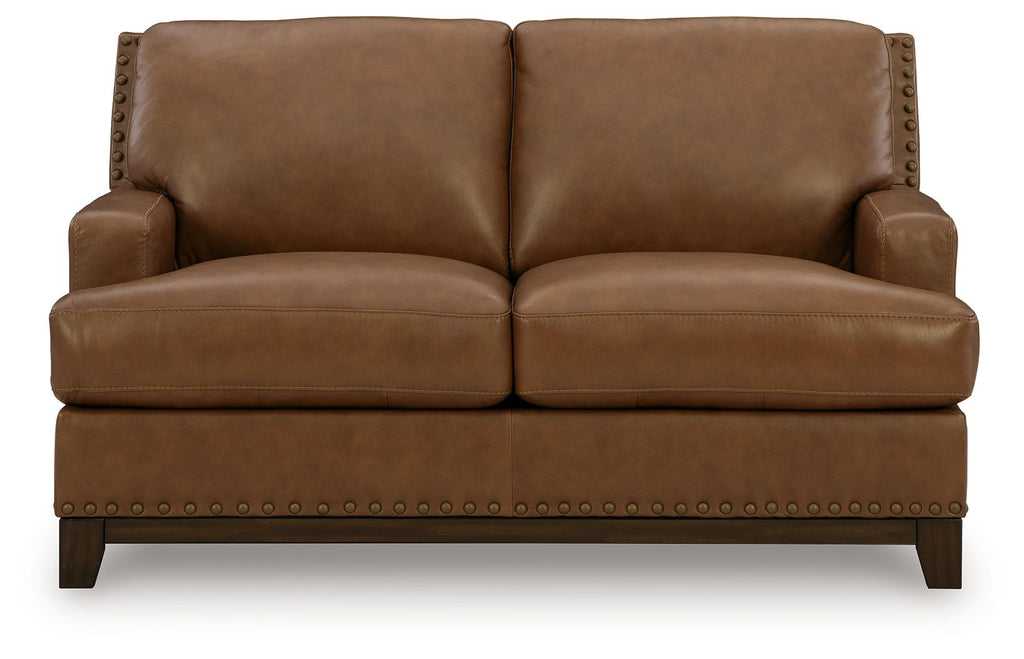 Brown loveseat sofa with nailhead trim and two cushioned seats, square arms and dark legs
