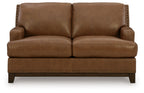Brown loveseat sofa with nailhead trim and two cushioned seats, square arms and dark legs