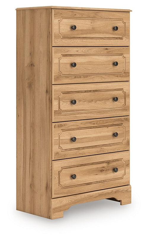 Warm brown five-drawer chest with carved drawer fronts and dark metal knob pulls