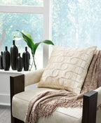 Kydner beige patterned pillow with stitched circle grid