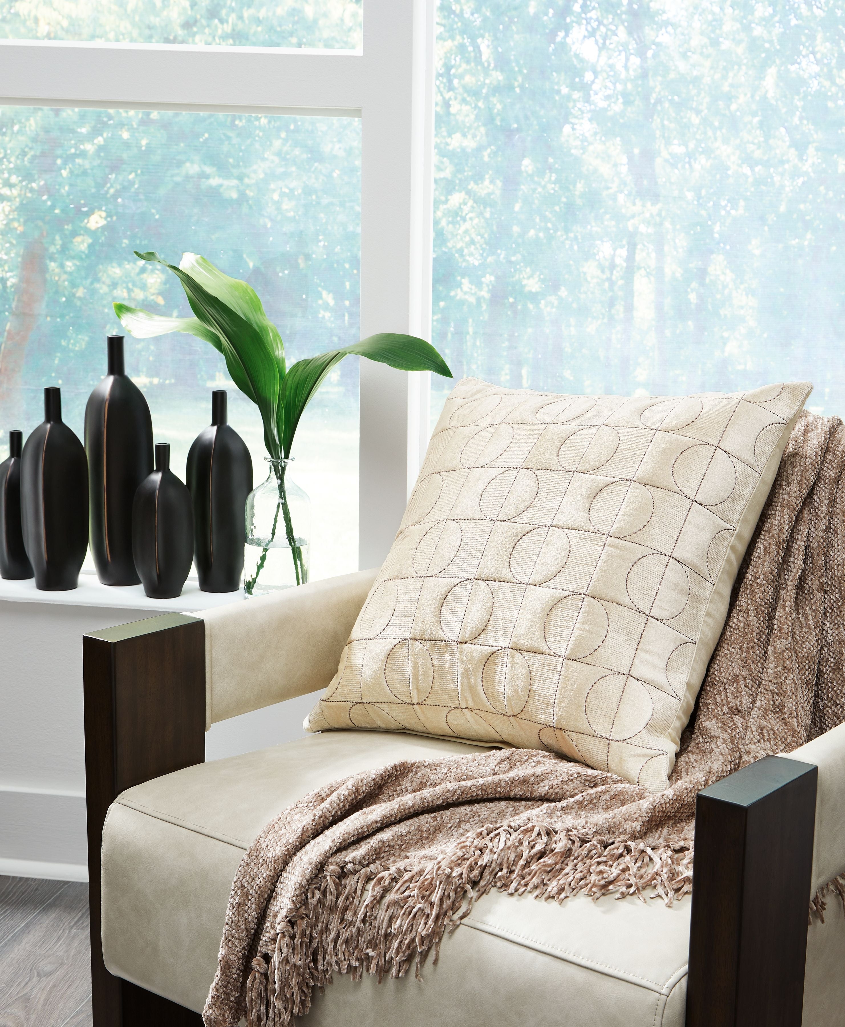 Kydner beige patterned pillow with stitched circle grid