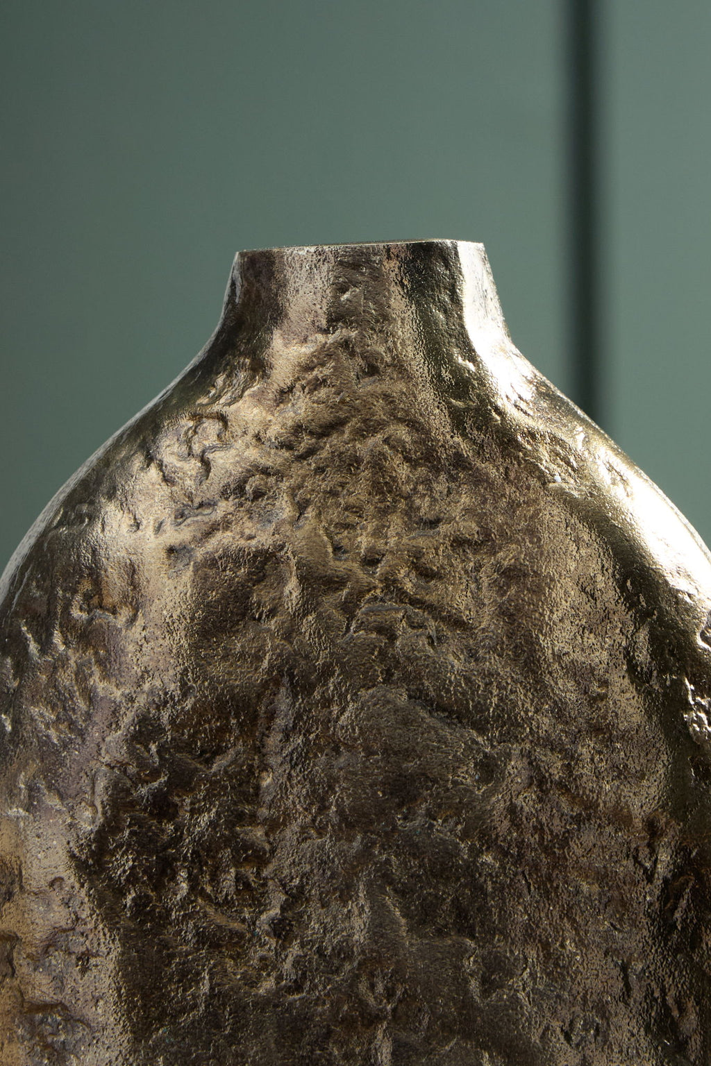 Wallmond vase with gold-brown hammered look and distressed surface texture.