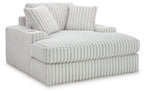 Oversized chaise lounge with ribbed upholstery, two back cushions, light gray