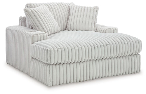 Oversized chaise lounge with ribbed upholstery, two back cushions, light gray