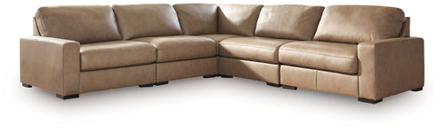 Sahara sectional sofa with chaise extension, padded arms, and back cushions