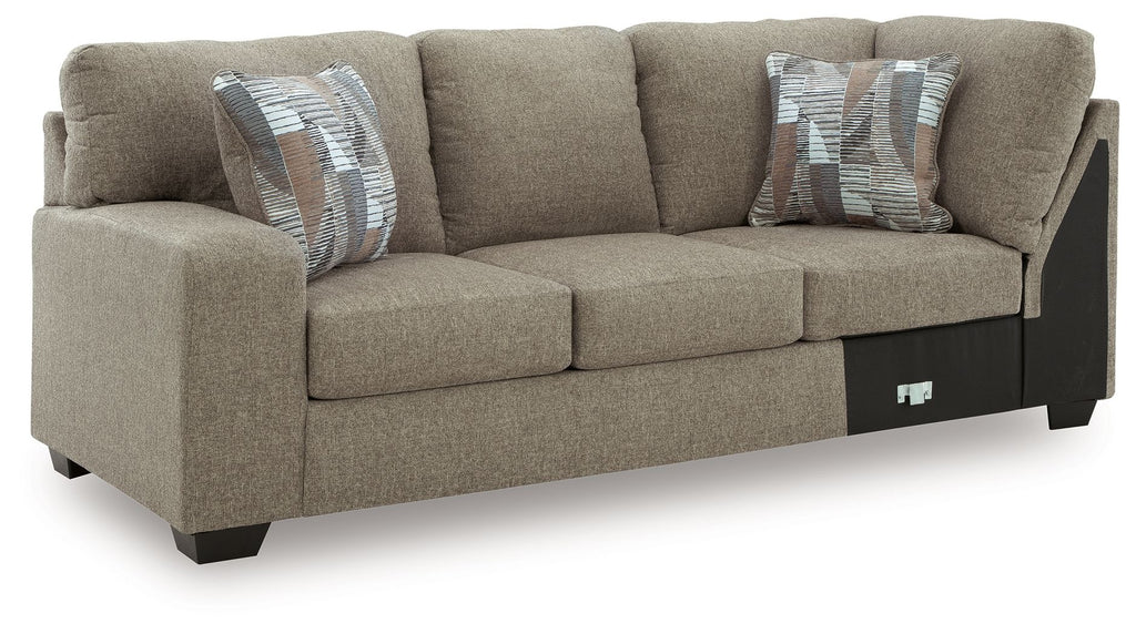 Newellen LAF sofa with corner wedge, beige fabric, three-seat design and throw pillows