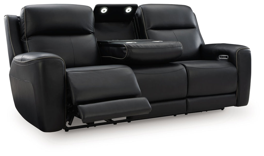 Power reclining sofa with adjustable headrests, black upholstery, reclined seat section shown