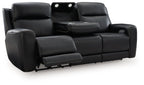 Power reclining sofa with adjustable headrests, black upholstery, reclined seat section shown