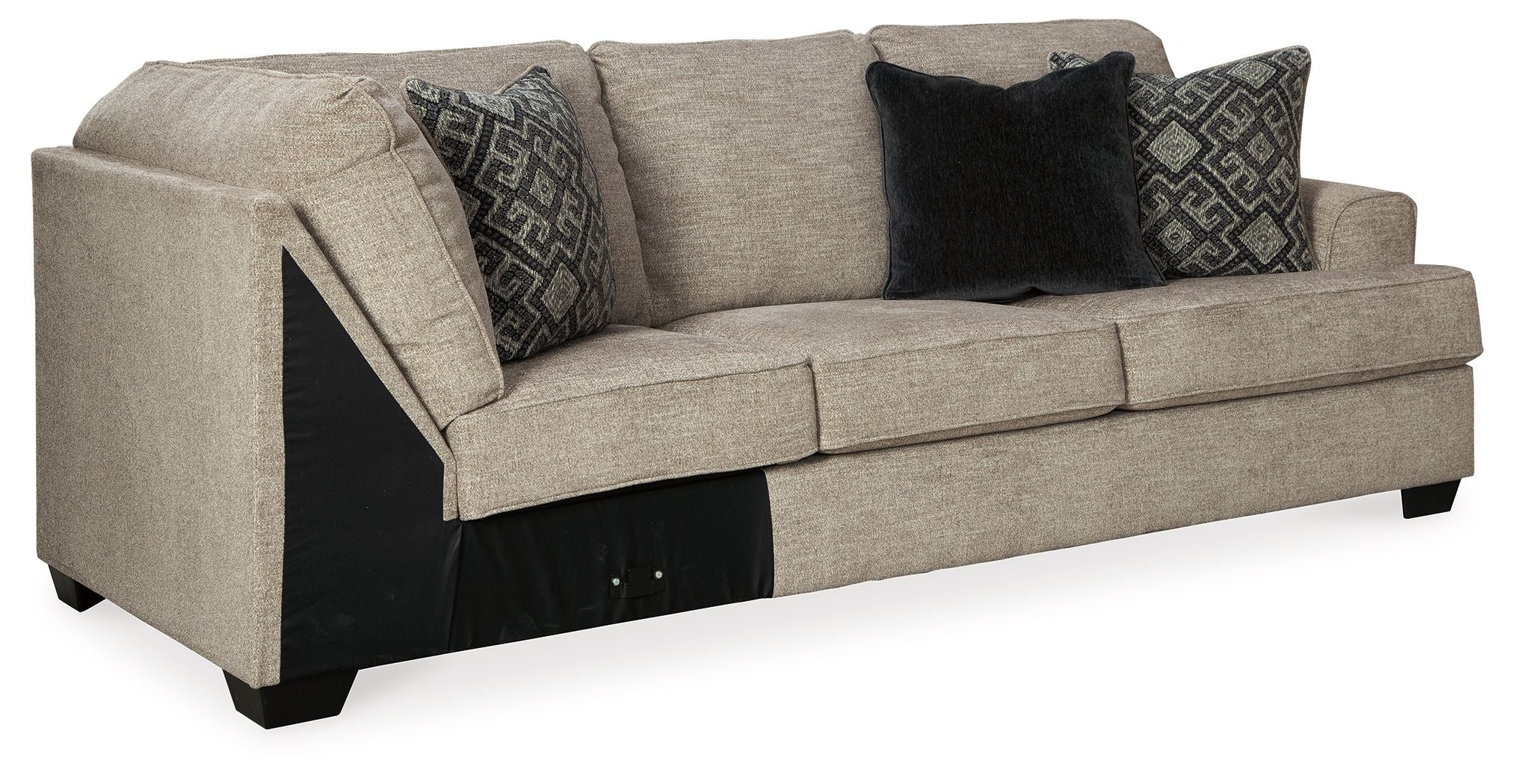 Stone-gray fabric sofa with corner wedge, tufted arms and dark patterned throw pillows