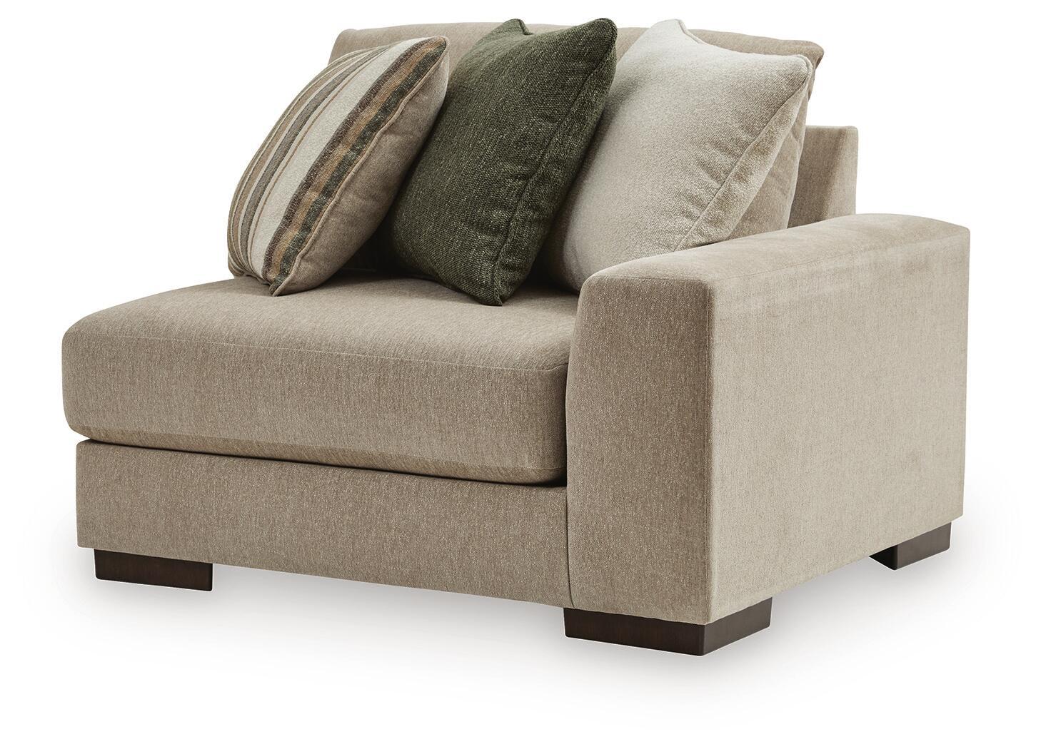 Linenhause RAF corner chair in light beige fabric with dark legs and four throw pillows