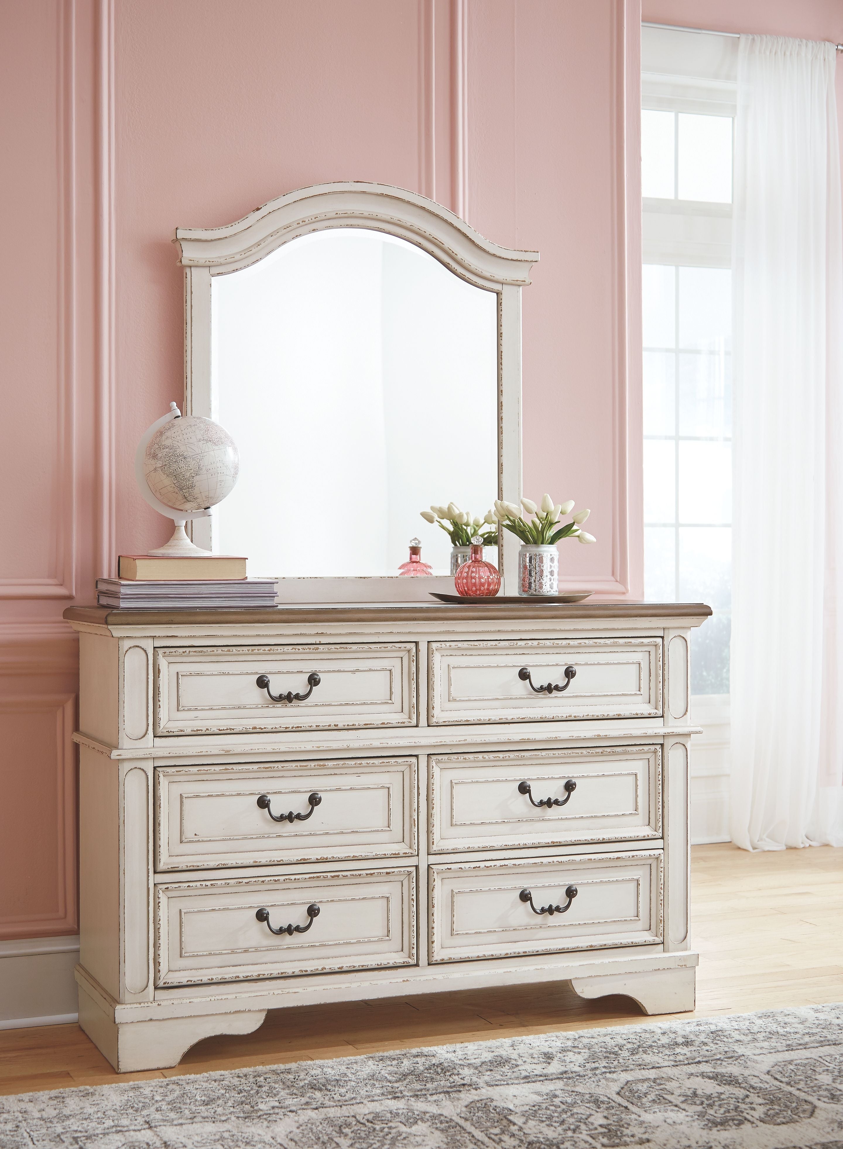 Two-tone dresser with attached arched mirror and six drawers, dark metal cup handles.
