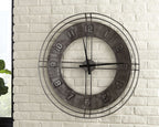 Antique gray wall clock with distressed dial, black hands, Arabic numerals, metal rim
