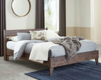 Light brown platform bed with white bedding, paneled headboard and wood footboard