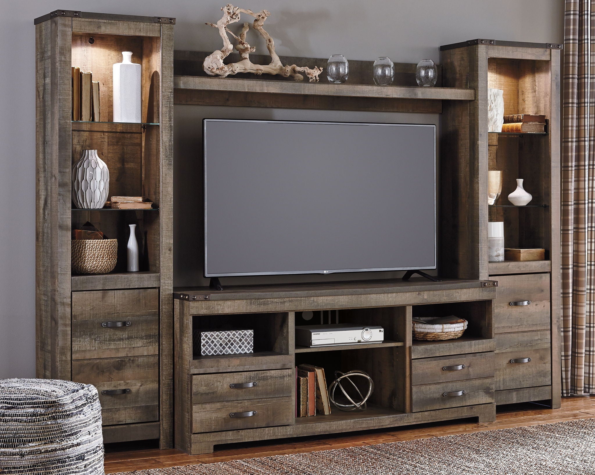 Dark brown entertainment center with TV mount opening, drawers, and glowing faux fireplace
