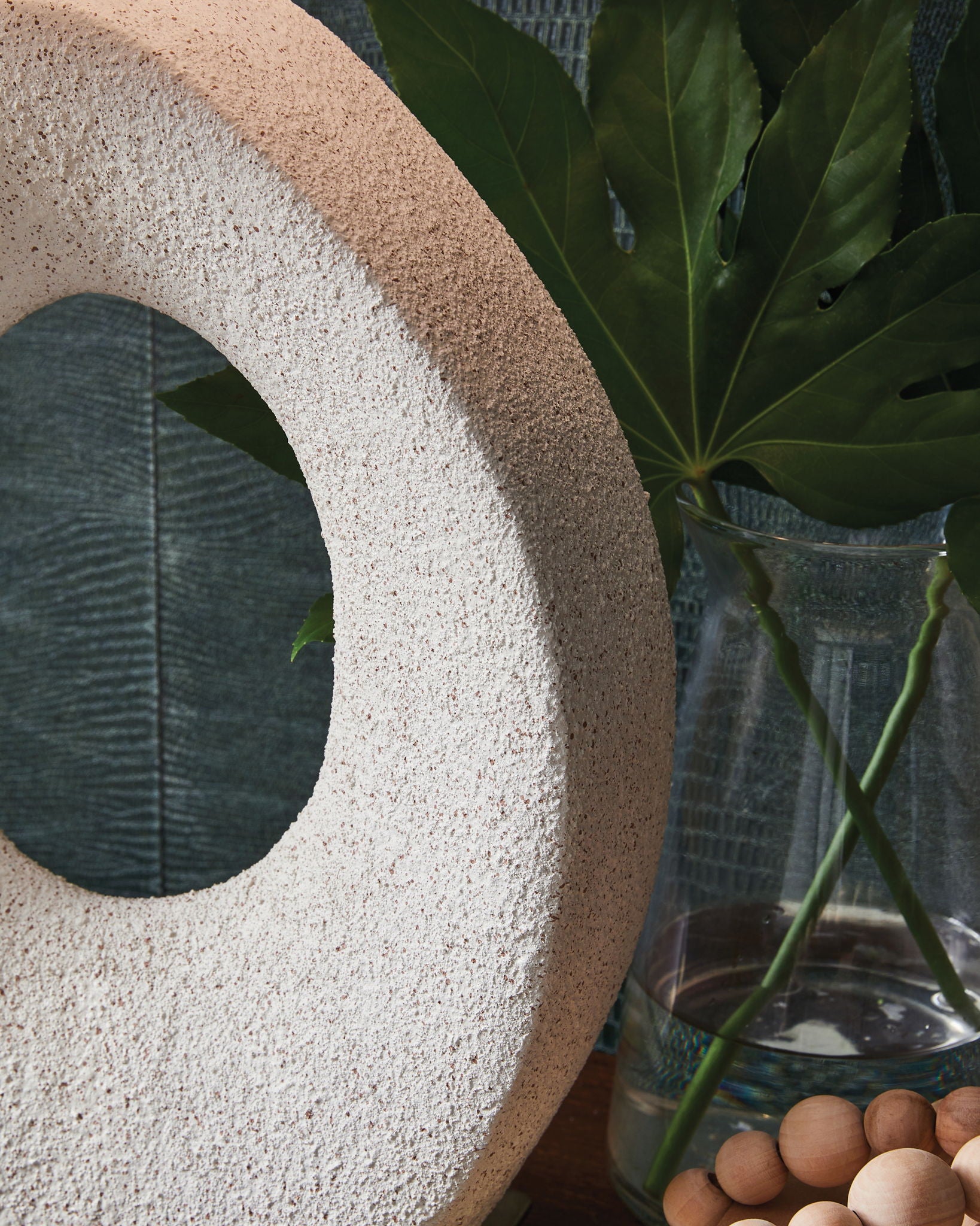 Paper table lamp base detail: speckled oval stone with cutout opening