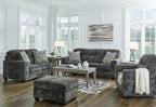 Dark gray living room seating set with sofa, chair, and ottoman