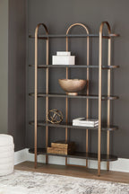 Brown bookcase with arched frame and open shelves, styled with decor on center shelf