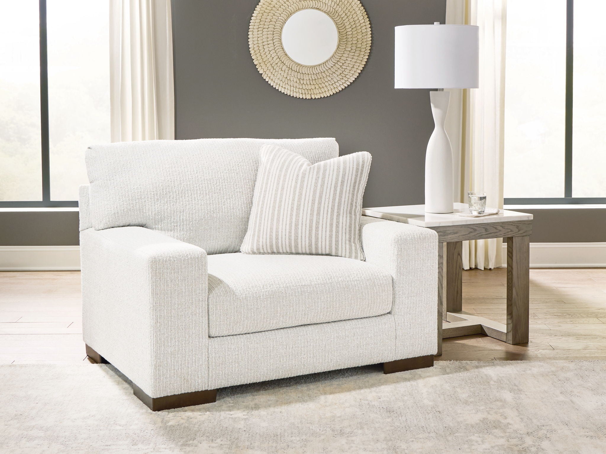Frosted chair and a half with light fabric seat, two cushions, dark legs