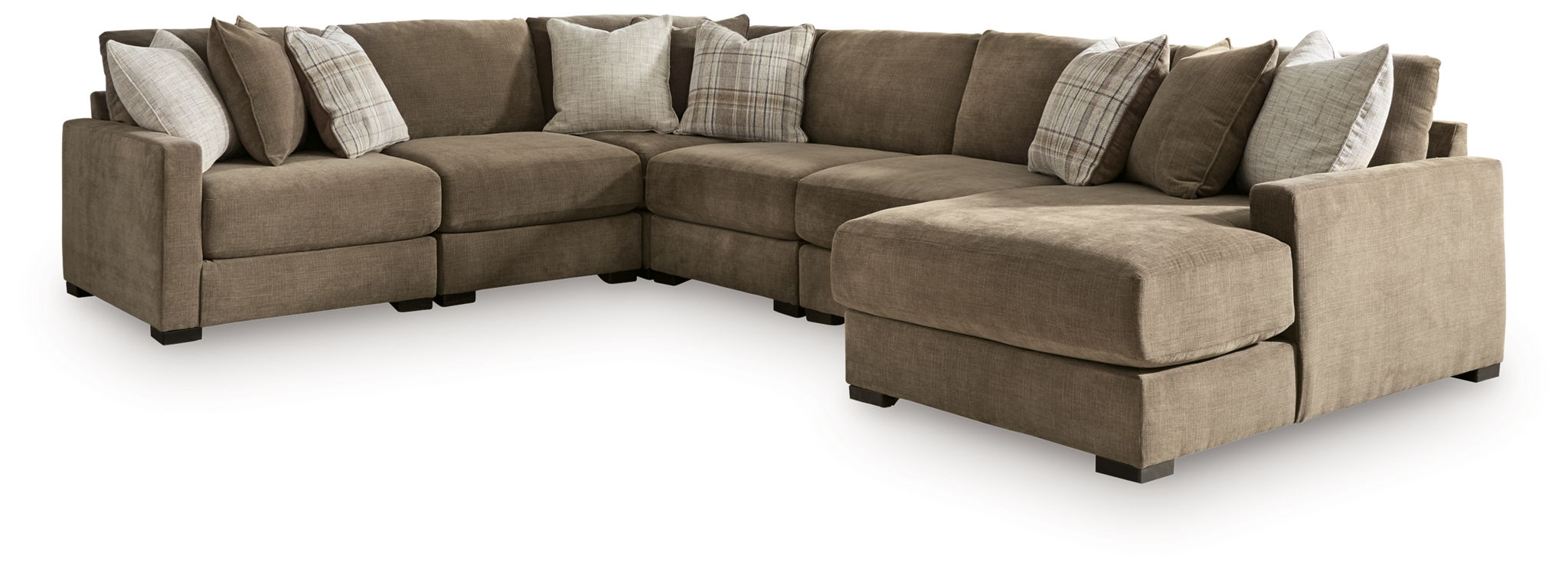 Coffee-brown sectional sofa with chaise end, corner seat, and layered throw pillows