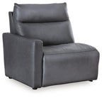 Dark gray upholstered power recliner chair with padded armrests and headrest