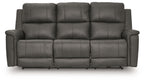 Dark gray power reclining sofa with three padded headrests and cushioned armrests