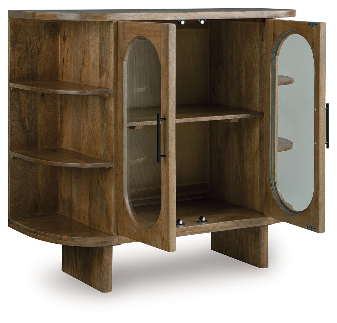 Light brown wood cabinet with open shelves, oval door panel, and round mirror