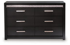 Black six-drawer dresser with six silver bar handles and a simple flat top