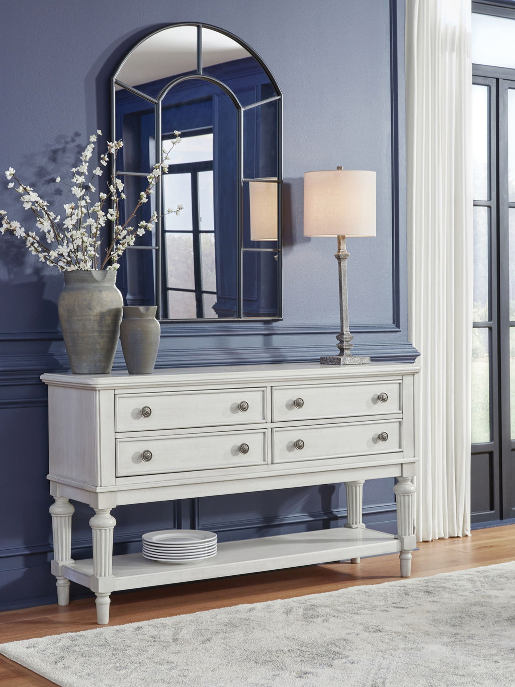Antique white dining room server with drawers and cabinet storage, turned legs