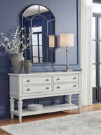 Antique white dining room server with drawers and cabinet storage, turned legs