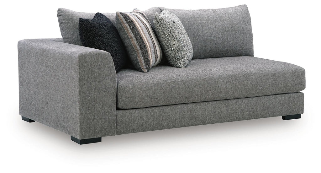 Gray upholstered corner chaise with tight seat and two accent pillows