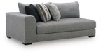 Gray upholstered corner chaise with tight seat and two accent pillows