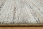 Nace rug close-up with cream base and gray textured distressed stripes