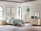 Beige bedroom set with bed, dresser, mirror, and nightstands in light wood