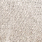 Close-up of light gray textured upholstery fabric for an accent chair