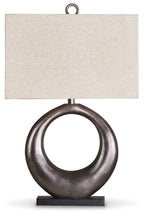 Antique silver metal table lamp with circular ring base and beige fabric shade