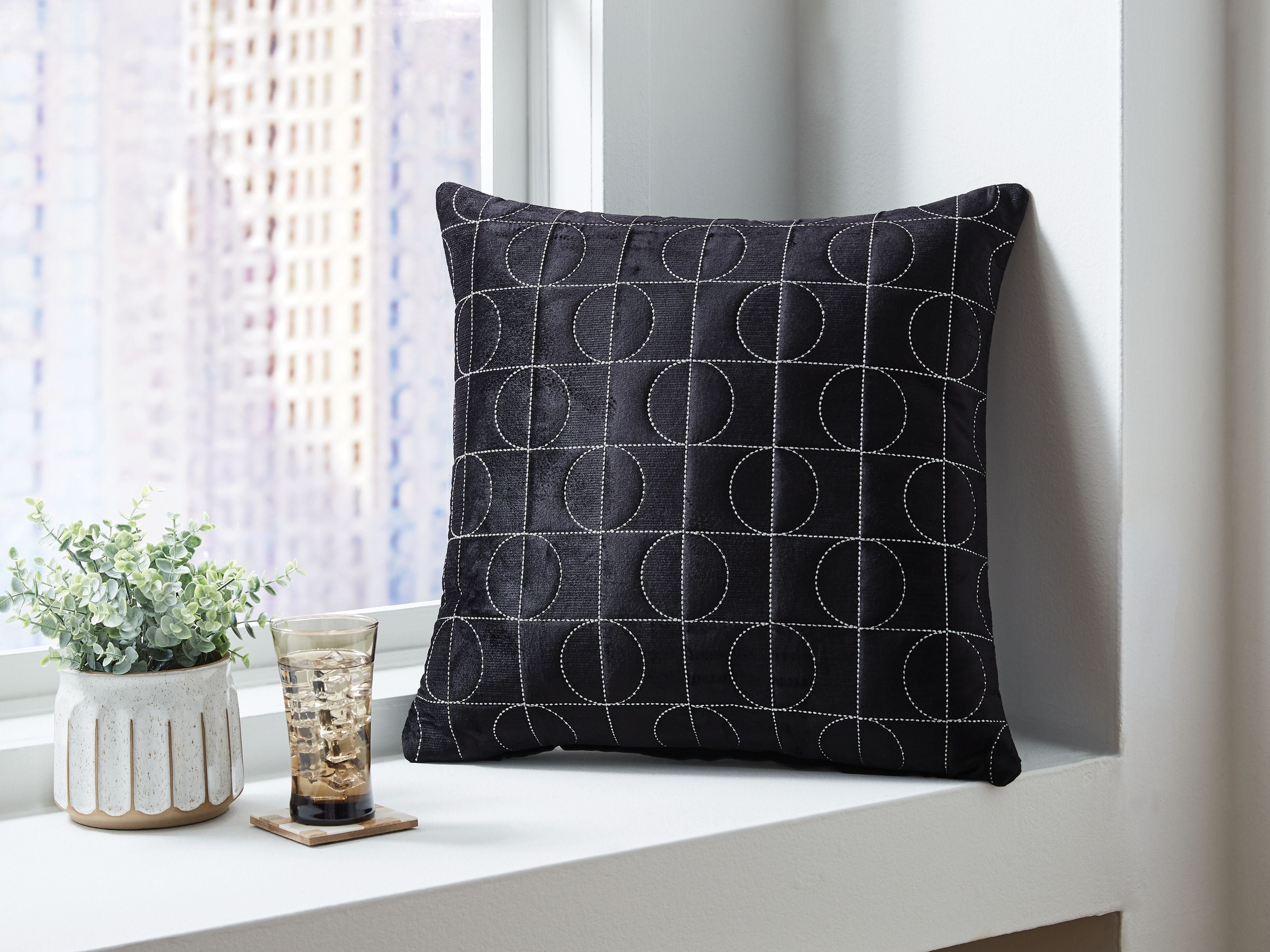 Kydner black patterned pillow with stitched circle grid
