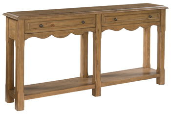 Light brown wooden console table with scalloped apron and drawer fronts
