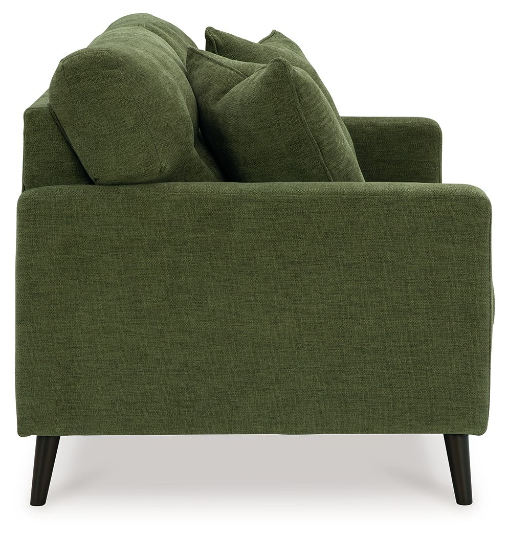 Green loveseat with thick arms and tufted back, shown from the side with three pillows.