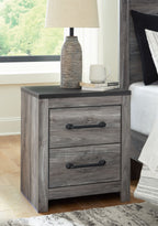 Two-drawer night stand in gray woodgrain with dark pull handles and straight legs.